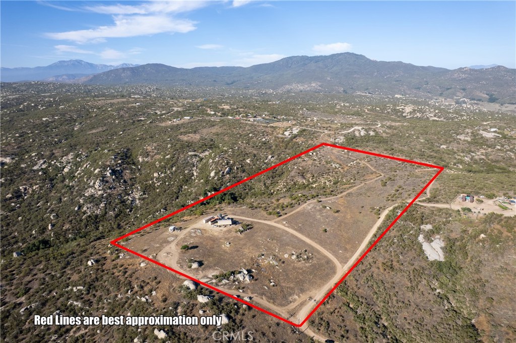 Back on market at NO FAULT of sellers ! King of the Mountain - The Last Property on Dusty TRL, Where Pictures Don’t Do It Justice. Off grid living!
Welcome to 39106 Dusty Trail, affectionately known as “Shiloh” (meaning place of peace) and true to its name, this remarkable property offers unmatched privacy, serenity, and panoramic views. Located at the end of Dusty Trail, backed by protected conservation land, and surrounded by sweeping vistas, this 20 + - acre property is truly one-of-a-kind. Enjoy breathtaking westward views of the Santa Rosa Plateau, Temecula Wine Country, Vail and Skinner Lakes, the Ortega Mountains, and Mt. Baldy. To the north, take in sights of Arrowhead and San Gorgonio; to the east, the Santa Rosa and Cahuilla Mountains; and to the south, the entire Palomar Mountain range — including the iconic Palomar Observatory. On the clearest days, even a sliver of the Pacific Ocean comes into view.
Included in the sale is a 34' fifth-wheel RV set beneath a permanent 40' x 34' steel canopy with an 8’ x 32’ wood porch fully equipped with a mini-split powered by its own solar array for year-round comfort. The RV is energy independent with three solar systems (two 2000-watt and one 3000-watt), all running on lithium-ion batteries, plus a water purification system and in-ground septic system.
Also included are two 40’ x 9’ highboy Connex containers, spaced 15 feet apart with materials on-site to complete a metal roof between them. One container is outfitted with three windows and an additional 2000-watt solar system with batteries. A rainwater collection system is in place and ready to be completed. There is also a leased 250-gallon propane tank and two 5000-gallon water storage tanks (installed ~3 years ago). The property features two drilled wells (currently unused), a nearly completed one-room casita, extensive brush clearing, and a network of cleared roads and trails throughout. Multiple potential home sites with jaw-dropping views await your custom build. Electricity is nearby at the edge of the property for easy connection. Both solar system's are included with the property and batteries.
Whether you’re dreaming of an off-grid retreat, a self-sufficient homestead. Rarely does a parcel with this combination of infrastructure, privacy, and natural beauty come to market. Rarely does an opportunity like this come to market a true blank canvas surrounded by breathtaking natural beauty. Your vision starts here. A MUST SEE IN PERSON!