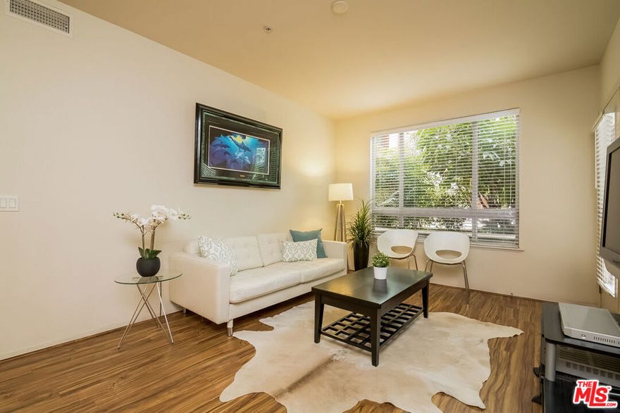 Experience spacious downtown living in this rare 3-bedroom end unit at Savoy, a resort-style community in DTLA's Little Tokyo District. This bright and inviting home features an open-concept layout with wood floors throughout, a modern kitchen with center island, granite countertops, upgraded refrigerator, and in-unit washer & dryer. Step out to your private patio overlooking the peaceful courtyard complete with a storage closet and two reserved parking spaces. Enjoy a host of lifestyle amenities, including a sparkling pool and spa, fitness center, business center, sports cafe, screening room, and rooftop deck with panoramic views of the Downtown LA skyline. The gated community also offers guest parking, multiple lush courtyards, and a 24-hour attended lobby. Perfectly situated near the Arts District, Little Tokyo, and DTLA's most dynamic dining, entertainment, and shopping destinations, all within easy reach of public transit and major freeways. ***Some utilities and 2 parking spaces included.***
