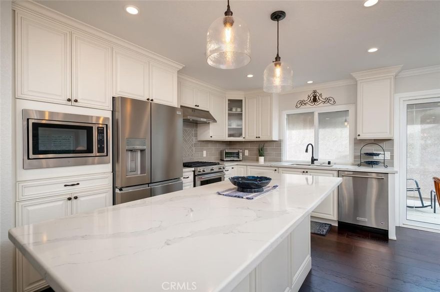 METICULOUS and Beautifully Remodeled Single-Level Home in Casta del Sol (55+ Community). As you walk into this stunning, move-in ready residence featuring a bright, open floor plan, soaring ceilings and modern upgrades throughout, you will be wowed by the feeling of space and comfort. Enjoy a meal with friends in the gourmet kitchen boasting all-new white cabinetry, stainless steel KitchenAid appliances, five-burner stove, pull-out shelving, soft-close drawers, new refrigerator and a spacious island with pendant lighting. No expense was spared updating this home!



The great room is welcoming with open ceilings and a custom fireplace and bar, recessed lighting and access to two patios—one private and one overlooking lush and serene tree views. Enjoy two spacious bedrooms, including the primary suite with new walk-in glass shower and closet; the second, oversized bedroom is quiet with built-in desk space to craft, work on the computer, etc. Both bathrooms were fully remodeled with new counters, sinks, tile and paint. Additional upgrades include real wood flooring throughout (no carpet), NEW HVAC, water heater, washer/dryer, epoxy garage flooring, plantation shutters, vinyl gates and stylish finishes throughout. This immaculate home was designed for my client with luxury and comfort in mind...



Resort-style living awaits in Casta del Sol with community pools, spa, tennis, pickleball, clubhouse activities and membership to Lake Mission Viejo for boating, fishing, sandy beaches, picnics and summer concerts. Ideally located near shopping, dining, medical centers, City Hall, parks and easy freeway access. This home is located on a quiet, cul-de-sac close to the community center - a must-see!