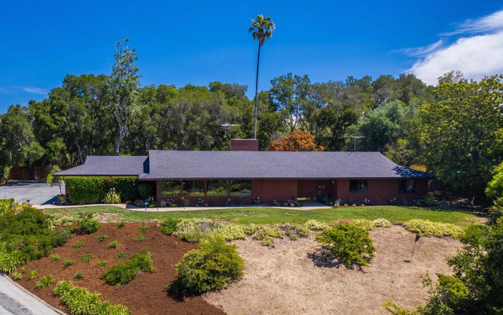 First time on the market. Original, Mid-century modern home with stunning views of the western hills. A hidden gem in the heart of Woodside Heights! Lot size is 1.25 acres and offers the opportunity to remodel, expand, or build new. 2980 square feet of living space with 4 bedrooms, including a primary suite, and 2.5 baths. The entryway welcomes you to living and dining rooms with high ceilings, views of the lush green forest and hills, and a fireplace. A large family room adjacent to the kitchen has a wall of built-in bookcases and doors leading to an inviting backyard with lawn area and patios. The bedroom wing offers spacious rooms with ample closet space and built-in cabinets lining the hallway. Each bedroom enjoys a view of the western hills or the private, appealing backyard. Just minutes from town, Stanford University, Sand Hill Road, Highway 280, and Silicon Valley. Outstanding Las Lomitas Elementary, La Entrada Middle, and Woodside High schools.