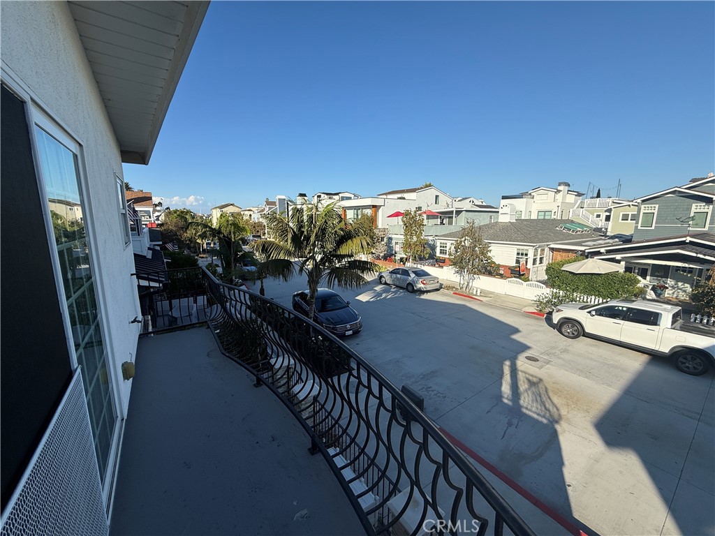 Positioned just one block from the sand or the bay, this 3-bed 3-bath top-floor home offers the rare opportunity to lease a coastal home on the coveted Balboa Peninsula. The top-floor location features a timeless, airy, and open-concept layout that seamlessly embraces the natural light and ocean breeze. The main living area flows seamlessly from the newly remodeled and updated chef’s kitchen into the expansive dining and living spaces, framed by vaulted ceilings and an abundance of windows. Each bedroom is generously proportioned, with three full baths providing privacy and comfort for relaxation and entertaining. The third bedroom features blackout window coverings, an expansive walk-in closet, and a remodeled spa-like bathroom. Additionally, solar panels are installed on the roof. Situated in one of Newport Beach’s most desirable enclaves, this home places you moments from the surf, the harbor, and the Peninsula’s celebrated dining and boutique scene—all while providing a quiet retreat above it all.