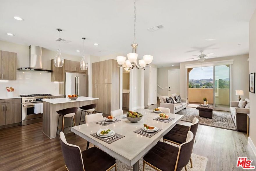 *SPECIAL OFFER LEASE RATE REFLECTS ONE MONTH OFF A 12 MONTH LEASE ON SELECT UNITS. ORIGINAL LEASE RATE $6,300.*                                                                                                                                       *ADDITIONAL MOVE IN INCENTIVE OFFERED * CONTACT AGENT*                                                                  Welcome home to this stunning tri-level luxury townhome at the Paxton Calabasas! This lovely "Carlisle" model is move in ready! This beautiful 2-bedroom, 2.5-bath townhome offers the perfect blend of comfort, style, and convenience across three well designed levels. Whether you're a professional, a student, a small family or anyone in between, this thoughtfully designed townhome provides everything you need. Features include two full bedrooms on the top level, both with attached bathrooms and generous closet space. The primary bedroom features a bright bathroom with dual sinks, soaking tub with a separate full shower with an attached private balcony with beautiful hill views. On the main floor, enjoy the contemporary kitchen, equipped with an island, beautiful pendant lights, stainless steel refrigerator, quartz countertops, oversized six burner gas stove top and oven. Also on the main floor, an open dining area and family room that includes 8 foot high sliding glass doors that open fully to access wonderful fresh air on the patio. Step to the bottom level and you will find the full size laundry room that features a smart washer and full size dryer, a generous bonus/ flex space with direct access to the attached 2 car garage. The garage offers a 220 volt charger. Cool off in the community pool, work out in the gym and relax in the clubhouse. Centrally located with close proximity to Malibu, Calabasas Commons, Erewhon, Westlake Promenade, less than an hour to Los Angeles, dining options, market, parks, top rated schools and Pepperdine University. * images with furniture are virtually staged and are of a similar unit.