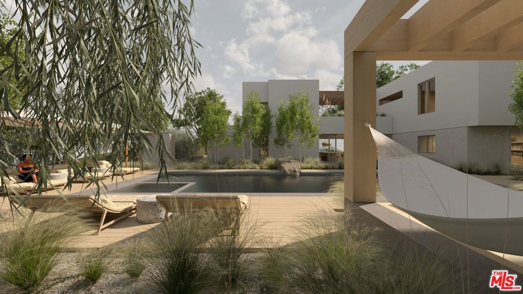 A rare 7.4-acre compound in one of Topanga's most prized locations, partially built and permitted to continue construction immediately. The main residence features a dramatic breezeway with custom Styline doors, and seamless indoor-outdoor flow with mountain views on one side and a pool and spa on the other. A detached guest house offers private one-bedroom and two-bedroom suites, along with a garage and pottery studio, ideal for guests or staff. Multiple flat pads allow for retreats, creative spaces, or gatherings. Permitting is already in process for two additional structures a large gym/spa and a double office. Fully designed by a top architect and designer, with a builder ready to go, this is a truly special property on one of the most desired streets in all of Topanga.