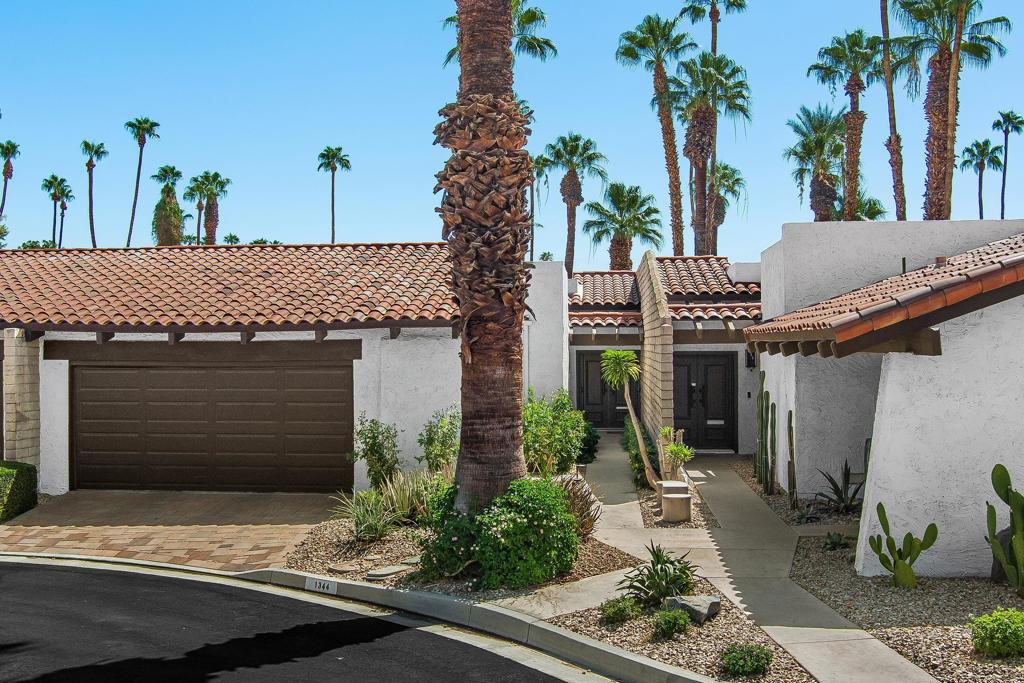 This exceptional 2-bedroom, 2-bathroom home is located in one of South Palm Springs most desired subdivisions. Deepwell Ranch is a boutique guard gated community on land you own. Designed by the renowned architect Barry Burkus, the home is built around an interior atrium that creates an inviting refreshing breeze and abundant natural light into your home all day long. Once inside you are greeted by an open concept with high beamed ceilings, walls of glass and distinctive slump stone walls. The kitchen has been refreshed with recessed lighting, countertops, gas cooktop and double ovens. The large primary bedroom offers tons of closet space and a luxurious spa-like bathroom with double vanity and wall to wall zero entry shower for easy access. Nicely sized guest bedroom with direct access to an updated bathroom which also has zero entry shower. Enjoy outdoor entertaining on the large patio overlooking open greenspace. Deepwell Ranch offers great amenities like 3 pools/spas, a freshly resurfaced tennis/pickleball court, and includes earthquake insurance in your HOA fee. Conveniently located near shopping, dining, and a local coffee house, this home combines location and accessibility in one of Palm Springs most coveted communities.