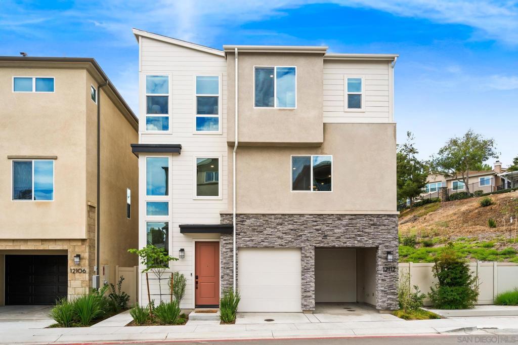 Welcome to 12112 Carter Lane—a beautifully maintained 4-bedroom, 3.5-bath residence nestled in the highly sought-after Carmel Mountain Ranch community. Built by Lennar in 2024, this thoughtfully designed home offers over 2,400 sq. ft. of light-filled living space on a coveted lot with rolling hill views. With owned solar, upgraded engineered hardwood flooring, and modern finishes throughout, this property seamlessly blends style, comfort, and efficiency—making it a true show-stopper. This home includes an attached ADU/Next-Gen suite with a private entrance, featuring a kitchenette and stacking laundry on the main level—an ideal setup for multigenerational living, long-term guests, or a dedicated home office. The main living areas offer a comfortable family room and an updated modern open concept kitchen with stainless steel appliances. Upstairs, the primary suite boasts dual walk-in closets and spa-like bath, while three additional bedrooms provide flexibility for family, guests, or lifestyle needs. Enjoy San Diego’s signature indoor-outdoor lifestyle with a private backyard and covered patio—ideal for both entertaining and quiet relaxation. This home also offers a two-car garage with an electric car charging station, modern finishes throughout, and access to the award-winning Poway Unified School District. Conveniently located near shopping, dining, and major commuter routes—including the I-15 and SR-56—you’ll also enjoy exclusive membership to community amenities such as a pool, sport courts, tennis courts, and a clubhouse.