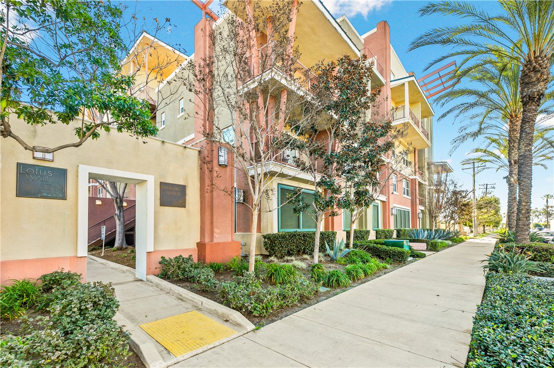 Location, Location, Location! Welcome to 12842 Palm St #204 — The Lotus walk was thoughtfully designed and beautifully crafted in 2007! This end unit is a charming 2 bedroom and 2 full bathroom condo located in a private gated building. An Elevator or stairs leads you to the 3rd floor where you are greeted with a view of the community atrium featuring seating and a gas fireplace. Once inside, the delightment continues with beautiful engineered hardwood floors, granite countertops and stainless steel applainces in the open concept kitchen. This corner unit is rarely on the market and boasts an extra window to allow the natural light to flow in. The lay out is great with a design that creates the ability to have 2 primary ensuites. A spacious living room has a balcony attached and is great place to BBQ or hang out. The crem de la crem in the unit is the huge primary bedroom with attached ensuite bathroom featuring a dual sinks on the vanity, deep soaking tub, separate shower, water closet and a walk in closet. This home is truly move in ready and the location is a dream! Just down the street from Disneyland, Great Wolf Lodge, Angel Stadium, UCI Medical Center, the Packing District, the Honda Center and soon to be OC VIBE complex! Adjacent to the 22 freeway to make an easy commute to work or the beach! Enjoy all the Lotus Walk amenities including a sparkling pool and relaxing spa. This unit comes with 2 tandem parking spots with storage in a gated garage. You won’t want to miss this one!