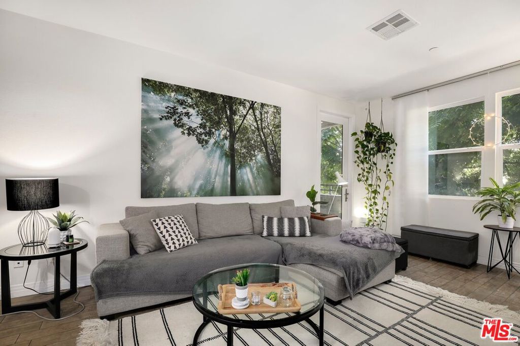 Discover modern comfort and convenience in this 2-bedroom, 2-bath residence located in the desirable Coronado community of Playa Vista. The home's open-concept layout is enhanced by sleek porcelain tile floors, creating a seamless flow between the living, dining, and kitchen areas. A well-appointed chef's kitchen features stainless steel appliances, upgraded countertops, a breakfast bar, and generous cabinet space, making it ideal for both casual meals and entertaining guests.The primary suite serves as a private retreat, complete with dual vanities, a soaking tub, and a separate glass-enclosed shower. The second bedroom is thoughtfully positioned away from the primary for added privacy. Step outside to your own spacious balcony and enjoy peaceful treetop views.Everyday living is made effortless with an in-unit washer and dryer, two reserved parking spaces, and a personal storage area in the community garage. Residents are just one block from the Centerpointe Club, offering resort-style amenities including a fitness center, pool, spa, screening room, and meeting spaces.With Playa Vista Elementary right across the street and the vibrant Runway at Playa Vista featuring Whole Foods, Cinemark, restaurants, and shops just moments away, this home delivers the best of both relaxation and urban convenience.
