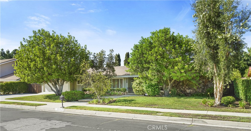 First time on the market in 23 years! This mid-century, ranch-style home is open and bright with windows and doors leading to a large backyard. Don't be fooled, she looks plain from the front, but this property is giving staycation every day. Freshly updated kitchen and bathrooms with mid-century elements blend nicely for a cohesive design. Quality plumbing fixtures from Price Pfister and Toto toilets are a bonus. Central A/C with Carrier equipment plus windows and doors by Milgard. High ceilings and open areas create a spacious interior. The park-like backyard has a pool set away from the house and a grassy area with trees for shade. There are garden boxes and fruit trees that give avocados, figs, lemons and oranges. This property has plenty of room to accommodate your landscaping dreams. Park your RV or boat behind the gate because you'll never want to leave home again. Located in the Granada Hills Charter High School zone.