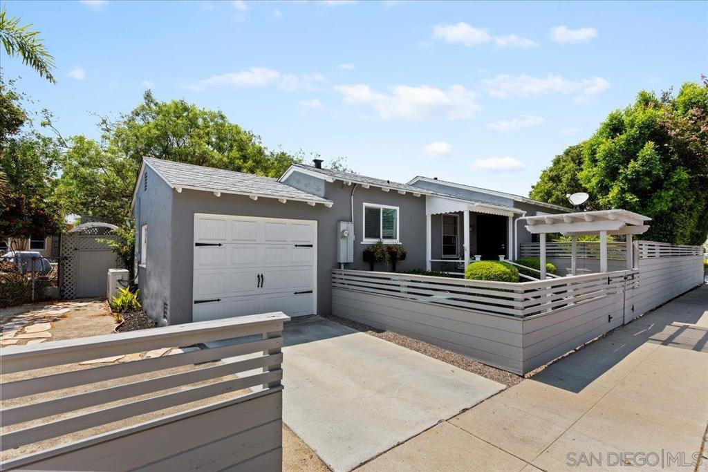 Nestled in the highly desirable Talmadge community, this captivating residence blends timeless charm with thoughtful modern updates. A welcoming pergola and gated entry set the tone, leading to a neighborly covered porch perfect for morning coffee. Inside, original hardwood floors with contrasting wood inlay, graceful soffit ceilings, and built-in cabinetry speak to the home’s character, while a beautifully remodeled kitchen impresses with designer cabinetry, quartz countertops, Carrera marble backsplash, stainless steel appliances, and recessed lighting. The stylishly renovated bathroom mirrors the kitchen’s elegance with Carrera marble details, a new glass shower door and designer flooring, creating a cohesive, sophisticated feel throughout. Designed for comfort and effortless entertaining, the home features central A/C, ceiling fans, and four inviting private outdoor seating areas to enjoy breezy afternoons with friends and family. French doors lead to the backyard and indoor/outdoor living! Fresh fencing and low-maintenance landscaping with drip irrigation enhance the outdoor appeal, complemented by recent upgrades including a new sliding glass door, updated electrical sub panel, new sewer piping to the alley and foundation upgrades. Perfectly positioned for convenience, you’ll be just minutes from vibrant coffee shops, dining, SDSU, parks, and hiking trails, with easy access to freeways and everyday amenities. This is your opportunity to enjoy the perfect balance of character, comfort, and location in one of San Diego’s most cherished neighborhoods.