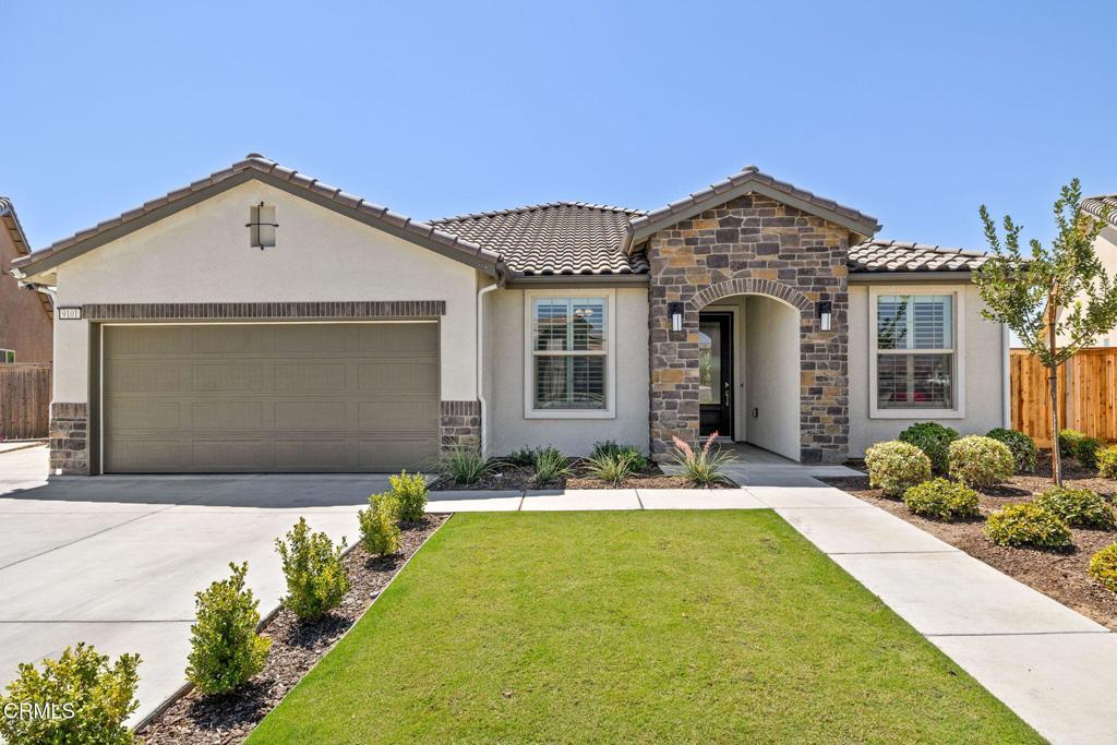 Modern Retreat on One of the Best Lots in Gossamer Grove - No HOA! Built in 2022, this 4-bed, 2-bath Bristlecone plan offers 2,015 sq. ft. of modern living with a desirable split-wing layout on one of the community's best oversized lots--private, spacious, and with no rear neighbors. The open-concept design features vaulted ceilings, a gourmet kitchen with quartz countertops, large island, stainless steel appliances, walk-in pantry, and wood-look tile flooring. The primary suite includes dual walk-in closets, double sinks, and a luxurious walk-in shower. A spacious laundry room provides linen storage and a handy shelf above the washer/dryer. Smart upgrades include a Ring doorbell, smart lock, garage opener, and Tesla wall charger. Outside, relax under the full-width covered patio with 3 ceiling fans and outlets, enjoy fruit trees, block wall privacy, and an extended side yard for kids or pets. Move-in ready, family-friendly, and no HOA fees--this home is a rare find!