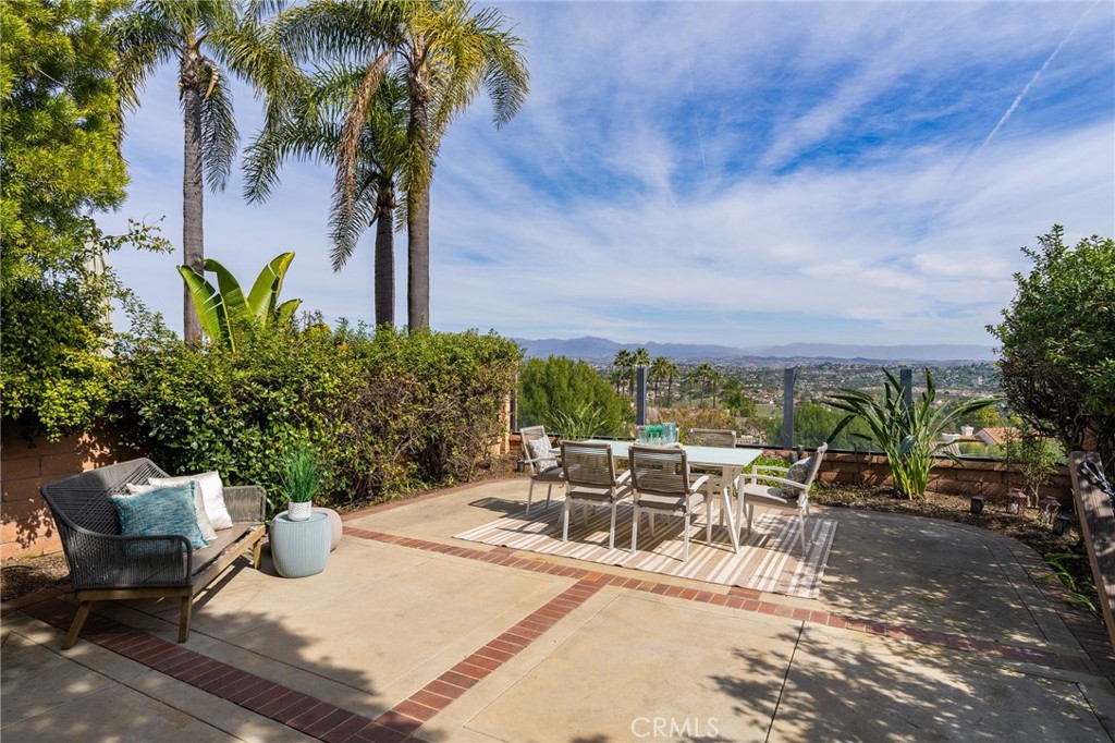 VIEWS, VIEWS, VIEWS! Welcome to your Niguel Summit dream home, where breathtaking panoramic canyon, mountain, and city-light views create an unforgettable backdrop to luxury living. Perched on a quiet ridge with no direct rear neighbors, this two-story home offers elevated privacy and stunning vistas throughout. Recently renovated from top to bottom with high-end designer finishes, this exceptional property sits in a prime location, just minutes from top-tier dining, shopping, and Southern California’s most iconic beaches and resorts. Step inside and be captivated by the light-filled open-concept living space, soaring vaulted ceilings, and unobstructed elevated views that will leave you speechless. The gourmet kitchen is a showstopper, featuring quartz countertops, a custom marble backsplash, brass fixtures, new stainless-steel appliances, and various other new kitchen features. The primary suite is a private sanctuary, complete with a serene balcony overlooking the breathtaking scenery. The spa-inspired ensuite features a soaking tub and luxury finishes designed for pure relaxation. The secondary bedroom is equally impressive, offering a high-end designer bathroom with a rain shower, Restoration Hardware cabinetry, and LED heated mirrors — pure indulgence at every turn. A third versatile space offers endless possibilities—convert it into a third bedroom easily and inexpensively (plans and quotes available upon request), home office, or loft to suit your lifestyle needs. Step outside to the picturesque garden patio, where you can relax and entertain against a backdrop of jaw-dropping views. Complete this luxury residence with home automation features, like Nest home automation and smart lighting. Need more? The community pool and spa are just steps away, along with world-class hiking and biking trails leading to cliff top ocean views. This is a rare opportunity to own a prime-view home in one of Orange County’s most coveted locations. Don’t wait—schedule your private tour today!