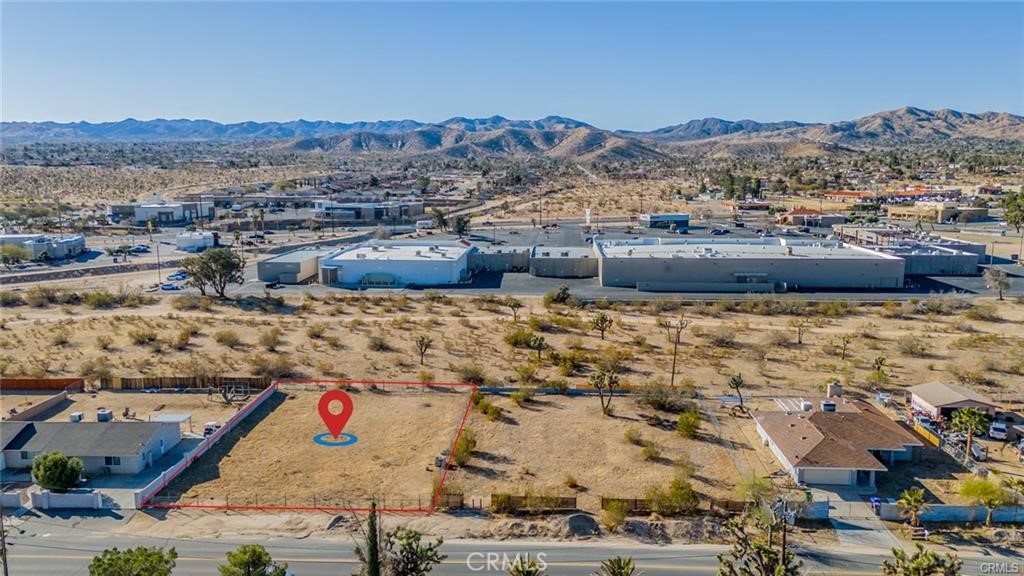 OWNER FINANCE... Great opportunity for owner/builder in a new neighborhood in Yucca Valley! Close to downtown and surrounded by wonderful views of the mountains. Easy access to Highway 62 and Old Woman Springs Road. Close to Yucca Valley Airport. Utilities appear to be easily accessible. This property is conveniently located near schools, shopping, grocery stores, gyms, pharmacies, fast food establishments, bowling alleys, and more. Lots to do within minutes of your future home! Also, just 10 minutes to downtown Joshua Tree. Fenced and ready to build on. Come and take a look for yourself. Don't Wait - Call Now!!!