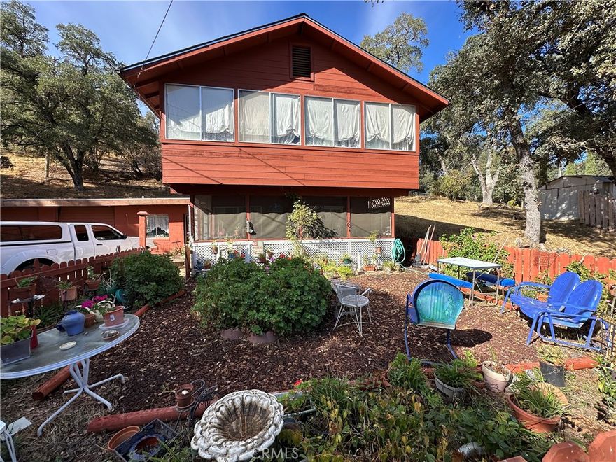 Home Sweet Home! Perfect permanent of retreat home. Unique 2 parcel opportunity located close to the city of Clearlake. This 3 bedroom home has a large sunroom adjacent to the large upstairs bedroom. Perfect to enjoy the morning sun. Living room has the rustic feel with the ceiling and a propane fireplace. Kitchen has electric range. The entry is a bonus room with a small wood burning stove. Downstairs bathroom has a claw foot tub. Artistic tile work throughout the home. The outside features an above ground pool with an outdoor shower and a. shop next to it.