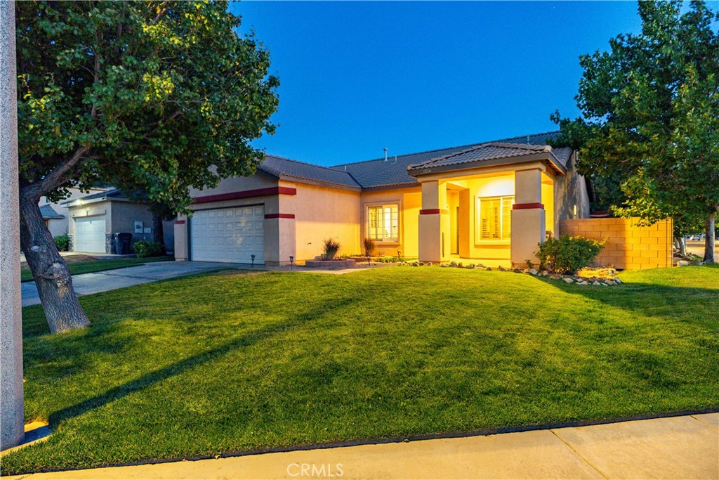 ***LIVE BEAUTIFULLY*** Move-In Ready Single-Story Home in West Lancaster – Paid-Off Solar! Welcome to this charming and commuter-friendly 3-bedroom, 2-bathroom single-story home in West Lancaster! With the freeway just minutes away, you'll enjoy convenient access while coming home to peace, privacy, and comfort. From the moment you arrive, you'll be impressed by the gorgeous curb appeal, featuring lush green grass and a welcoming front porch. Step inside to a light-filled, open family room complete with a cozy fireplace, ideal for relaxing or entertaining. The heart of the home is the spacious kitchen, offering ample cabinetry, a center island, and a sunny breakfast nook—perfect for casual dining and gatherings. An indoor laundry room adds to the home's everyday convenience. The primary suite is your private retreat, with direct backyard access, a separate soaking tub and shower, and a large walk-in closet for all your storage needs. Step outside to your park-like private backyard, showcasing vibrant green lawn, a beautifully built covered patio, and a charming flower bed—ideal for relaxing, entertaining, or gardening. Best of all, this home includes PAID-IN-FULL SOLAR, providing excellent energy savings from day one! No electric bill since installed, always generated a surplus! Don’t miss this opportunity to own a beautifully maintained, move-in ready home. Schedule your tour today!