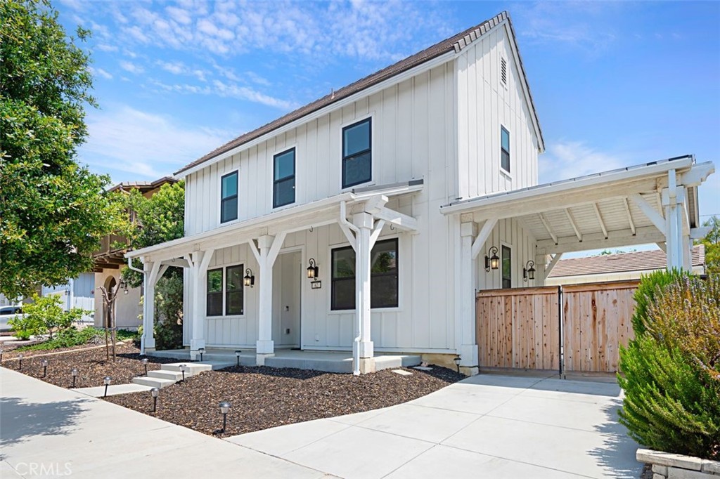 Welcome to this newer-built 4-bedroom, 3-bathroom home, located in The Farm, one of Ventura’s most sought-after communities. Designed with both style and functionality in mind, this residence offers a perfect balance of luxurious finishes, a thoughtful layout, and everyday comfort. From the covered front porch to the moment you step inside, the home impresses with its impeccable attention to detail. Elegant vinyl plank flooring and a bright, contemporary palette set the tone throughout. The open-concept living space seamlessly connects the kitchen, dining, and family room, making it ideal for entertaining or relaxing with loved ones. At the heart of the home is a chef’s dream kitchen, featuring quartz countertops, upgraded appliances, a gas cooktop, and a spacious island that serves as both a breakfast bar and a central gathering place. A walk-in pantry and coffee bar offer abundant storage, ideal for culinary enthusiasts. Downstairs, a private bedroom provides a perfect guest suite or home office. A versatile flex room adds even more function—ideal for formal dining, a second office, or a playroom. A convenient hall bath adds extra practicality to the main level. Upstairs, the expansive primary suite offers a peaceful retreat complete with a custom walk-in closet. The spa-inspired bathroom features quartz finishes, dual vanities, a soaking tub, and a large walk-in shower. Two additional bedrooms share a full bathroom with dual sinks, and a conveniently located laundry room simplifies daily routines. Step outside to your own private backyard oasis, which includes a covered patio, concrete pavers, a turf lawn, and privacy fencing. A gated porte cochere adds charm and privacy, leading to an oversized 2-car garage. Best of all, there are no HOA fees or Mello-Roos. This home is a rare opportunity to enjoy upscale living in a vibrant, community-oriented neighborhood, just minutes from Ventura’s beaches, trails, parks, and downtown charm.