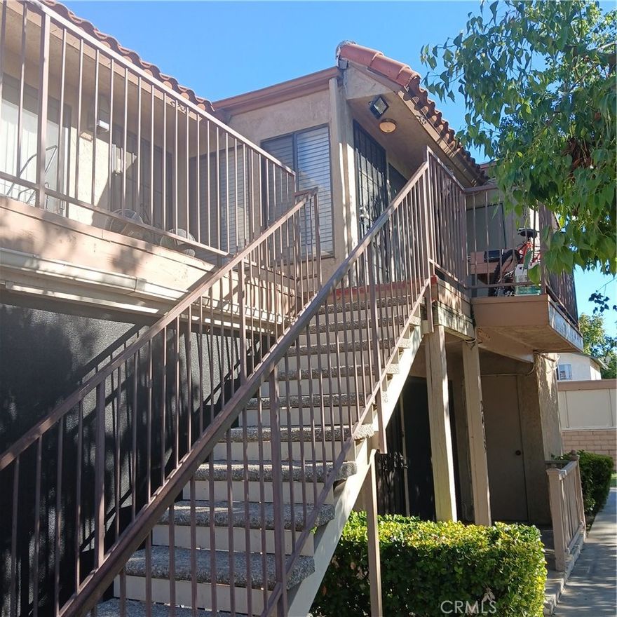 Rarely available upper end unit in 50 unit Acacia Gardens complex.  All ages are welcome.   Two bedrooms and two bathrooms. The two car detached garage is a short walk from the unit.  Both the front gate and the rear vehicle entry gate are secured.  Acacia Gardens features a pool and gazebo, and is near the Hemet Valley Mall, restaurants and Bank of America.  Your low HOA fee of $288.00 includes water, sewer and trash.  Low tax rate keeps your monthly payment down.