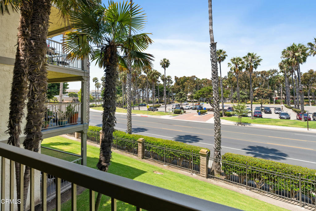 Welcome to your coastal retreat! This beautifully updated condo features an open-concept layout with stylish tile flooring throughout the main living areas, crown molding, and recessed lighting for a bright, modern feel. The spacious kitchen boasts granite countertops, rich wood cabinetry, and a large island with seating for six - perfect for entertaining family and friends.Relax in the inviting living room that flows seamlessly through a dual pane sliding door to your private balcony, where you can enjoy ocean breezes and peaceful views of palm trees and landscaped grounds and a peek-a-boo ocean view. The home is accented with coastal-themed artwork and decor, creating a relaxed beach vibe throughout. The generous primary bedroom offers a dual pane sliding glass door to the balcony, deep navy accent walls, plush carpeting, and a colorful surf-inspired design that brings the beach indoors. There's a second generous bedroom for family or guests. The updated bathrooms provide modern practicality and comfort. Amenities include an indoor pool and spa, gym, game room, meeting area, BBQ area and there's an elevator just across from your second floor front door!Located just steps from the sand, this condo is ideal as a primary residence, vacation getaway, or investment property. Experience the ultimate in beachside living today! Don't miss this move-in ready opportunity to own your slice of paradise!