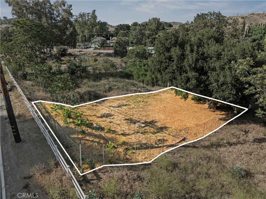 Opportunity is knocking! This is your chance to own this flat, usable R-1 zoned land for a single family residence. Fully fenced and conveniently located off a paved street, with water, gas and electricity available right at the front of the property. Nestled in a peaceful, quiet neighborhood, among established homes, close to a community park and just minutes from the freeway, shopping center , dining, Magic Mountain Theme Park and approximately only one hour away from the beach. Soil Test Report also on hand and ready to provide it. Don't miss out on the opportunity to snag this land! FYI in case you go view the lot it's facing paved road Chiquita Cyn Rd not Taylor St.