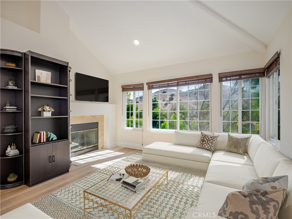 Beautifully Updated Condo in Prime Calabasas Location. Welcome to 4240 Lost Hills Rd Unit 3005, an inviting upstairs corner unit in the highly desirable Las Virgenes School District. This bright and spacious home features soaring ceilings, large windows, and an open floor plan that seamlessly blends comfort with style. The living room boasts abundant natural light, a cozy fireplace, and direct access to a private balcony that is perfect for relaxing or entertaining. The dining area flows into a well-equipped kitchen with stainless steel appliances, ample cabinetry, and a breakfast bar for casual dining. The primary suite offers vaulted ceilings, a serene view of the surrounding hills, and generous closet space. Additional highlights include in-unit washer and dryer, a private garage with plenty of guest parking, and community amenities surrounded by lush landscaping. Located less than half a mile from De Anza Park, with a short drive to Malibu's beautiful beaches, this home combines convenience, comfort, and the best of Calabasas living. Key Features include: Upstairs corner unit with vaulted ceilings, loft, Bright and open floor plan with fireplace and balcony, Stainless steel, appliances and breakfast bar, Private garage plus guest parking, In-unit washer and dryer included, Top-rated Las Virgenes School District, Close to hiking trails, parks, and Malibu beaches. Don’t miss this opportunity to own a stunning condo in one of Calabasas’ most sought-after communities!