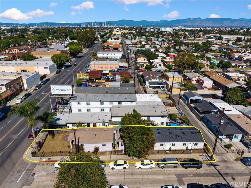Incredible 4 unit investment opportunity in South Los Angeles! This beautifully improved property features a front house with 2 bedrooms | 2 bathrooms. A second unit with 1 bedroom | 1 bathroom. Plus two brand-new ADUs (built in 2025) each a stylish 1 bedroom | 1 bathroom home with luxury finishes and modern amenities throughout. Property Highlights Front House 2 bedroom | 2 bath with long-time loyal tenants. Features granite countertops, tile flooring, washer and dryer connection. Second Unit 1 bedroom | 1 bath delivered ready to move in. Includes granite countertops, tile flooring, washer & dryer, wall AC, stainless-steel refrigerator & stove, microwave, and mounted TV. Two Brand-New ADUs, each features 1 bedroom | 1 bath with Calacatta Pietra tile shower & floor. Beautiful kitchen with Calacatta Quartz countertops, griege cabinetry, and brand-new counter-depth appliances refrigerator, stove, range hood. Mini-split heating & air conditioning in bedroom and living room. Marble vanity with LED touchscreen smart mirror. Vinyl wood-style flooring and modern black hardware throughout. Color-adjustable uplighting and spacious closet with lighting. Electric water heater, garbage disposal, stainless-steel sink + soap dispenser. Individual electric & gas meters and all-electric units. Hardwired Ring camera, smoke/CO detectors, and large attic storage. Additional Details Total of three (3) units delivered ready to move in at closing. Energy-efficient, all-electric ADUs with split AC/heating systems. Beautifully finished interiors with marble, quartz, and designer lighting. Prime location near schools, shopping, and public transportation. Perfect for investors, multi-generational families, or owner-occupants seeking rental income. Enjoy modern living, high-end design, and income potential all on one fully improved property in the heart of Los Angeles.
