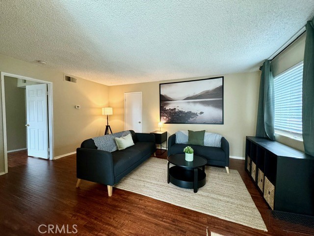 Look no further than this charming 1 bed, 1 bath condo in the Aliso Creek Villas of Lake Forest. This home features updated vinyl flooring, an open living area, and a private patio. The spacious Primary bedroom offers an en-suite and walk-in closet. Enjoy access to three community pools and a playground. This property is centrally located and close to nearby shopping centers, the Lake Forest Golf Course, and the 5 Freeway. This is a great opportunity to own a home at a great price!