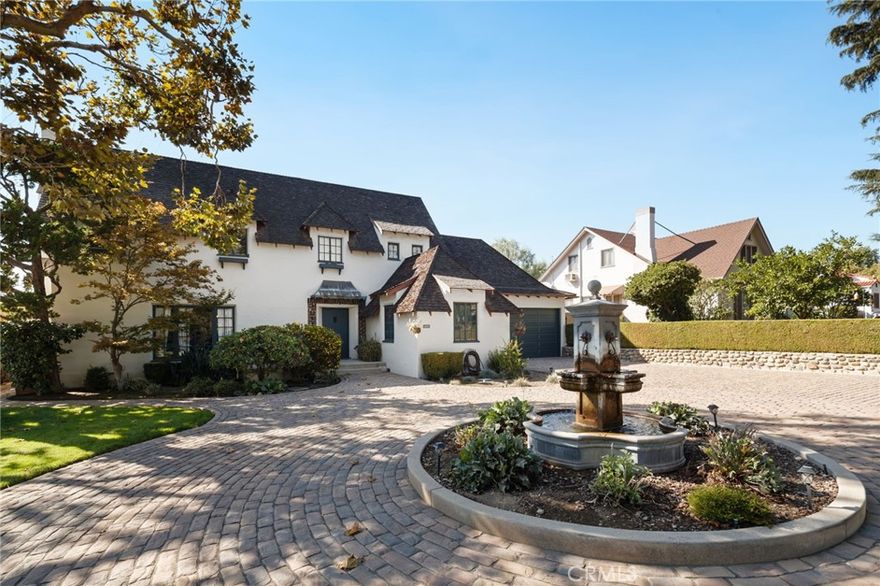 This beautifully preserved 1929 English Revival home showcases timeless Old-World charm, with unmistakable French architectural influences. From its steeply pitched gable roof and storybook silhouette to the elegant arched doorways and original detailing, the home evokes the romantic ambiance of a European countryside manor. Whether viewed as a classic example of Tudor/English Revival or through its refined French styling, this two-story residence offers a rare blend of architectural heritage and artistic craftsmanship. Circular Motor court and fountain greet you and your guests. Entry with grand staircase. Large rooms. Remodeled kitchen with butler's pantry. Rotunda breakfast room with windows to the wonderful, landscaped backyard. Recording studio or office off garage gives it endless possibilities. Built 1929 this Historical property is on the Mills Act which affords it substantial Tax Advantages. Please call for more details. Truly a Country Estate that sits on a 11,250 sq.ft.lot.