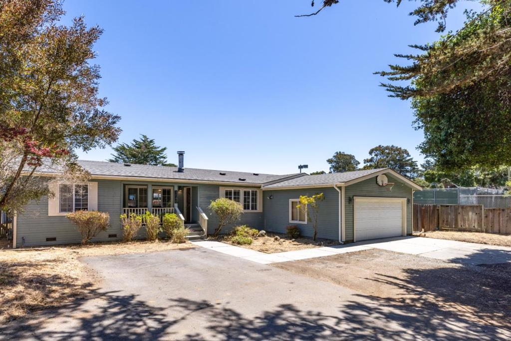 Sought-after Upper Seaside Location. Tucked away down a secluded driveway, this spacious 4-bedroom, 2-bathroom home offers nearly 2,400 square feet of comfortable living. Updated in 2020, the kitchen and flooring blend modern touches with timeless charm. The home features an oversized living room, a cozy family room with a fireplace, a dedicated dining area, and a generously sized primary en-suite complete with a soaking tub. The expansive yard provides room to relax, entertain, or garden. Ideally located near beaches, scenic hiking and biking trails, local shops, restaurants, and all the amenities the Monterey Peninsula has to offer.