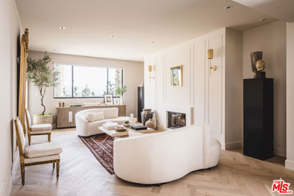 An impeccably reimagined pied--terre nestled in the vibrant heart of the city. This refined 2-bedroom, 2-bath residence is perched within the prestigious Century Park Place, offering sweeping vistas of city lights and lush treetops. Bathed in natural light, the expansive living areas open to a generously sized terrace an ideal setting for effortless indoor-outdoor living. The gourmet kitchen is appointed with top-tier appliances, abundant custom cabinetry, and an inviting breakfast nook. The sumptuous primary suite is a serene escape, complete with a private terrace, fireplace, and generous wardrobe closets. The spa-inspired bath features an oversized glass-enclosed shower, separate water closet and a dual sink vanity. Set within a coveted 24-hour guard-gated enclave, residents enjoy an array of resort-style amenities including three sparkling pools, multiple al fresco dining areas with BBQs, fully equipped fitness centers, tennis and pickleball courts, a club room, and attentive on-site staffall curated to elevate daily living into an artful experience of ease and sophistication.