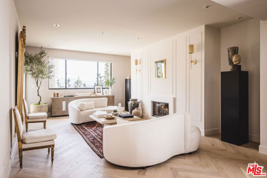 An impeccably reimagined pied--terre nestled in the vibrant heart of the city. This refined 2-bedroom, 2-bath residence is perched within the prestigious Century Park Place, offering sweeping vistas of city lights and lush treetops. Bathed in natural light, the expansive living areas open to a generously sized terrace an ideal setting for effortless indoor-outdoor living. The gourmet kitchen is appointed with top-tier appliances, abundant custom cabinetry, and an inviting breakfast nook. The sumptuous primary suite is a serene escape, complete with a private terrace, fireplace, and generous wardrobe closets. The spa-inspired bath features an oversized glass-enclosed shower, separate water closet and a dual sink vanity. Set within a coveted 24-hour guard-gated enclave, residents enjoy an array of resort-style amenities including three sparkling pools, multiple al fresco dining areas with BBQs, fully equipped fitness centers, tennis and pickleball courts, a club room, and attentive on-site staffall curated to elevate daily living into an artful experience of ease and sophistication.