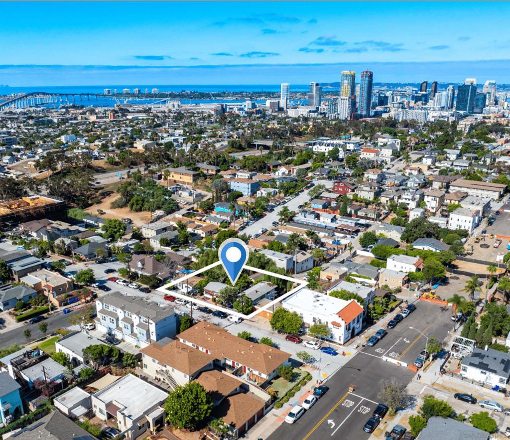 We are pleased to offer 918-32 27th Street, an advantageous three-lot assembly in San Diego’s vibrant Golden Hill neighborhood, offering a blend of immediate income and substantial redevelopment potential. Comprised of 3 parcels on a 17,560 SQ FT lot, this property distinctively features six revenue-generating duplex units. There are currently three (3) one-bedroom/one-bathroom units (500 SF each) and three (3) two-bedroom/one-bathroom units (600 SF each). The units, a mix of long-term leases and furnished short-term rentals, provide consistent cash flow for investors. Located in a Qualified Opportunity Zone (QOZ) with RM 2-5 zoning, an SDA overlay, and Tier 3 Complete Communities designation, the site supports a 6.5 FAR, enabling up to 113,951 square feet of buildable space, potentially yielding a 125+ unit development. With historical clearances already secured, the lot’s elevated position offers sweeping views of the San Diego skyline and Coronado Bridge, enhancing its allure for future residents. Golden Hill’s lively urban fabric, with a Walk Score of 86, places tenants within steps of eclectic experiential dining spots like Turf Supper Club and Counterpoint, boutique shops, and cultural hubs like the San Diego Museum of Art and the Golden Hill Fountain Grotto, Balboa Park’s oldest design feature. Quick access to Downtown, North Park, Hillcrest, and major freeways (I-5, I-94) ensures seamless connectivity and convenience from this central location.