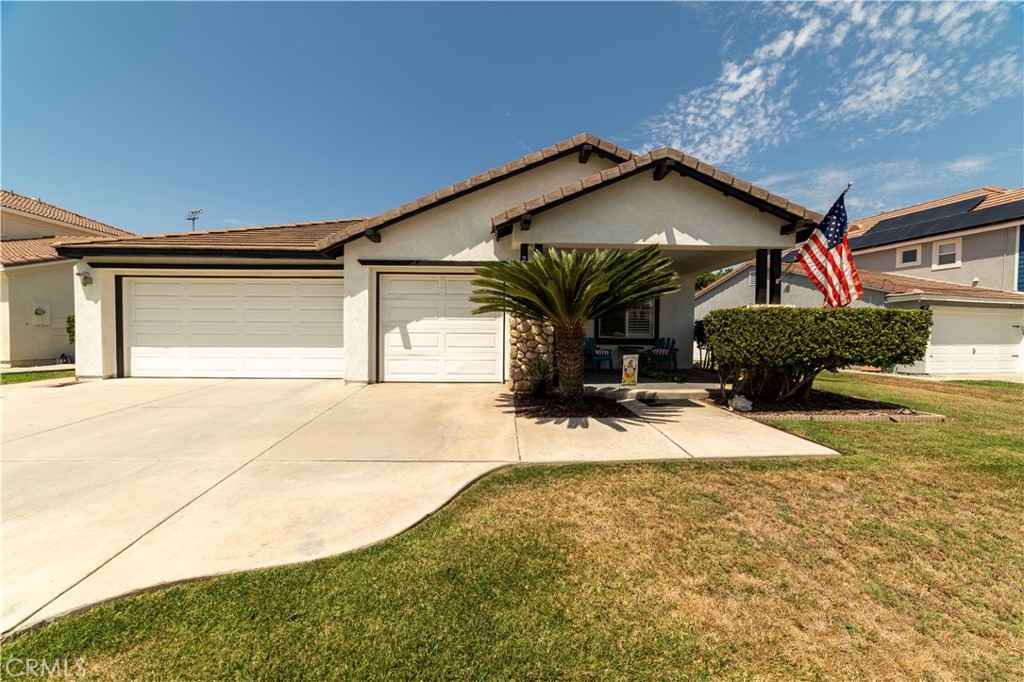 Beautiful Single Story with Pride of Ownership! Recently painted, this home has both front and rear patios. This gorgeous 3 bedroom plus bonus room 2 bath home features a formal living dining with pergo flooring and a recessed wall for storage or a tv, your choice! Walking through to the wide open renovated kitchen with mobile island, the kitchen has custom tile both on the floor and as a backsplash. Open to the family room this is truly a great room with two ceiling fans and a custom light feature. Three cutouts in the drywall perfectly showcase whatever you want to and custom cabinetry in the family room allow you to store all your stuff! Go down the hallway with a built in desk and more cabinetry to bedroom one, which currently has a large opening to the family room - good for using as a den, craft room or bedroom! Both the secondary bathroom and primary bathroom have been upgraded, with custom basins. The primary bedroom has pergo flooring, a ceiling fan, plantation shutters and a slider to the backyard. The backyard has block walls along the back, and new vinyl fencing in between the homes as well as a bbq island on its on porch. Across the rear of the home is an alumnawood patio and concrete pad to set up a nice entertaining area. Property also has a recently installed water softener and water filtration system. Solar power will need to be assumed, but the seller only pays $85/month and has not had to pay more to Edison!