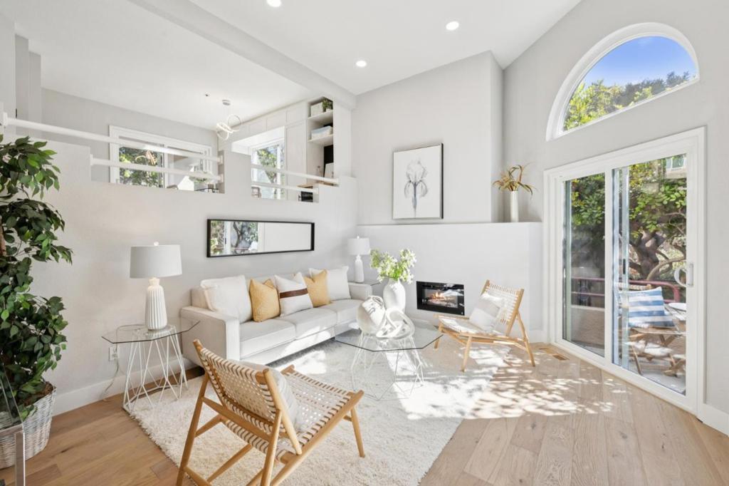 Stunning contemporary end unit townhome elegantly designed and beautifully remodeled to perfection with high-end finishes throughout. Extremely sunny and bright with remarkable city view. Great modern floor plan with two bedroom suites, high ceilings and ample living spaces. Office or study area in landing area. Large windows and sliding doors providing lots of natural light. Amazing kitchen with quartz counters and mosaic tile backsplash, high gloss cabinets, high quality stainless steel appliances. Luxurious primary bathroom with large shower and double sinks, chic vanity and LED mirror. Primary suite with built-in closet organizers and trendy closet doors. Gorgeous hardwood floor, double pane windows, recessed LED lights throughout. New stylish chandeliers and LED fireplace. In-unit laundry and attached side-by-side 2 car garage with extra large storage. Right next to Metro Center, CVS, Safeway, salon and restaurants. Top-rated schools, library, parks, lagoon trail & recreational center nearby. Easy access to HWYs 101 and 92.