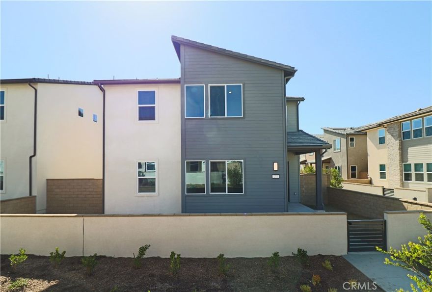Welcome to brand new  beautifully upgraded two-story home in the desirable Portia plan 3 community at Great Park. Offering approximately 2,546 sq. ft. of modern living space, this residence features an open floor plan with a gourmet kitchen highlighted by quartz countertops, premium stainless steel appliances, and a spacious center island that flows into the light-filled dining and living areas.

A rare dual-staircase layout enhances the home’s functionality. One staircase leads to the primary suite with a walk-in closet and spa-inspired bath, along with two secondary bedrooms and a shared bath. The second staircase opens to a versatile loft, a private bedroom, and a full bath—ideal for guests, multi-generational living, or a home office.

Additional features include an attached two-car garage, smart home technology, a solar system, and an in-home washer and dryer. Residents enjoy access to Great Park’s resort-style amenities, including pools, parks, sports courts, and playgrounds. Lease solar panels.