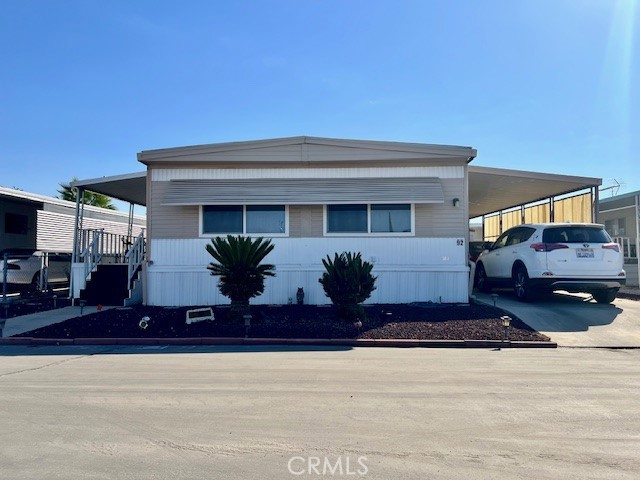 Welcome to this beautifully, 3-bedroom, 2-bathroom home. Located in the highly desirable 55+ community Caravana Estates, conveniently located near the Ramona Expressway in San Jacinto. The open floor plan includes a spacious living area and a well-appointed kitchen, perfect for hosting and daily living. Equipped with central air and heating, the home ensures year-round comfort. The interiors are appointed with vinyl wood flooring and carpeting. The outdoor space includes a patio, ideal for relaxed seating, and a backyard suited for gatherings. A dedicated laundry area accommodates full-sized washer and dryer units. The community offers excellent amenities, including a well-maintained pool, spa, and a dedicated dog run area. Potential Buyer will need park approval. WON’T LAST LONG!!! MUST SEE!!