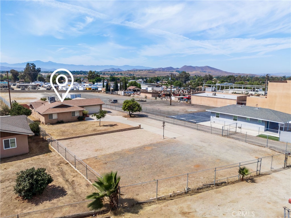 Rare Find! Multi-Use Commerical/Industrial and Residential Property Located in the Thriving City of Jurupa Valley, CA. Property Zoned M-SC & Residential! ((Manufacturing-Service Commercial)) Sitting on Approx ***1.02 Acres of Usable Land*** Offering Outstanding Investment Opportunities-Live/Work and Invest All in One Place- This Unique Property has Endless Potential for Commercial Development Options, Expanding Your Business Operations, Investments, or Immediate Use! Includes Approx 1,291 Sq Ft of Functional & Flexable Living Space with 3 Bedrooms-2 Baths, Updated Kitchen, Granite Countertops, Wood Laminate Flooring in Kitchen, Dining, and Family Area, Fresh Interior Paint - Move-in Ready! Or Turn house into Office for Your Onsite Business? Lease? Investment? 2 Car Garage with Patio and Fruit Trees! Please Note: This Property CAN BE SOLD WITH ADJACENT PROPERTY. MLS#IG25185314 APN #163-180-010 (800 Sq ft office on 1.52 Acres) The Possibilities Are Endless-This is a Must-See! Don't Miss This GOLDEN Opportunity this Property Has to Offer!!