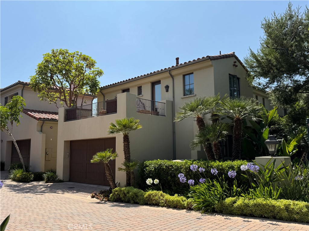 Nestled in the prestigious gated community of Crystal Cove, 132 Sidney Bay is a Seascape Villa offering daily picturesque sunsets, offering a fresh contemporary aesthetic and the ultimate coastal lifestyle. The 2,908 SF home features four bedrooms and 4.5 baths, with the main level featuring an en-suite bedroom, a remodeled kitchen with WOLF and SubZero appliances, a dining area, and two living areas flooded with natural light, with expansive sliding doors opening onto a private patio perfect for al fresco dining. Upstairs, the master suite boasts stunning ocean and sunset views over Catalina Island and features an office retreat, two walk-in closets, and a spa-style bathroom. Bedrooms 3 and 4 each open onto spacious, sun-filled balconies. In addition to providing privacy and security, Crystal Cove is within walking distance of the beautiful Crystal Cove Beach, State Park, and shopping promenade, as well as access to upscale community amenities like the Canyon Club.