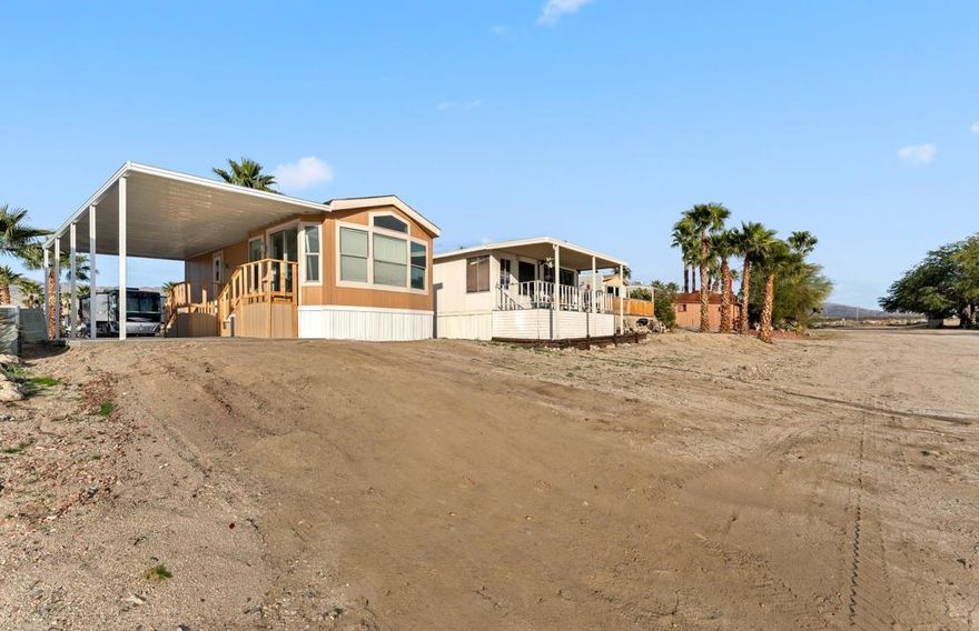 Welcome to The Sands RV & Golf Resort, a well-maintained 55+ gated community offering an active, resort-style lifestyle. This 1992 manufactured home is situated on a wash-adjacent lot, providing open space behind the home and a more spacious feel compared to interior locations within the park. The home features one bedroom and one bathroom with approximately 460 square feet of interior living space. Exterior highlights include a covered carport, concrete driveway and patio areas, and low-maintenance surroundings.Interior improvements are currently in progress. The seller is installing new vinyl flooring in select areas, completing a bathroom remodel, and finishing interior paint. A new mini-split system has recently been installed to provide efficient heating and cooling. The kitchen is partially completed at this time. Interior photos will be uploaded once all work is completed, estimated within the next two weeks.The seller is motivated and is open to considering offers prior to completion, with a commitment to finish the agreed-upon scope of work as part of the transaction. Space rent is $680 per month and includes water and trash. Buyers must obtain park approval and meet community requirements.Residents of The Sands RV & Golf Resort enjoy access to a wide range of amenities including a large heated swimming pool with spas, golf driving range, natural grass putting and chipping green, pickleball courts, fitness center, recreation and activities rooms, card and billiard rooms, library, laundry facilities, dog parks, workshop, and clubhouse services.This is an excellent opportunity to secure a home within a desirable 55+ resort community while final improvements are being completed.