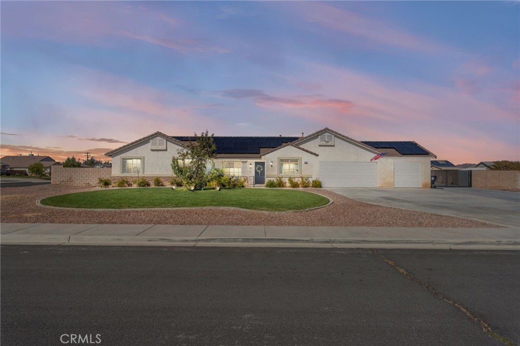 Reliance Drive is beautifully upgraded 2,434 sq ft 5-bedroom, 3-bath, custom pool home. Sitting on a large corner lot, you’ll find professional landscaping, gated front courtyard, and an extra-wide driveway with an iron drive-thru security gate for secure RV/boat concrete parking in the huge backyard.
The open floor plan balances shared spaces & privacy. Vaulted ceilings and abundant windows fill the home with natural light. The upgraded kitchen includes white cabinetry, pantry, Professional stainless appliances (refrigerator negotiable), 6 burner stovetop with convection/air fryer steam oven, Gorgeous Carrera Marble countertops and backsplash, and recessed lighting. At its center is a full-size custom island crafted of black wrought iron and matching Carrera Marble (negotiable). The kitchen opens to a breakfast nook with a bay window, and a spacious great room with a cozy stacked-stone fireplace, custom ceiling fan, and adjoining living room—perfect for everyday living & entertaining.
The split floorplan places the private primary suite on one side of the home, featuring a double-door entry, vaulted ceilings, and glass slider access to the backyard. The ensuite bath has dual vanities, soaking tub, glass shower, and walk-in closet. A secondary bedroom nearby works well as an office or nursery. Three additional bedrooms and a third full bath sit on the opposite side of the home, providing flexibility for family & guests. An indoor laundry room and finished three-car garage add convenience & storage.
The backyard was designed for relaxation and low upkeep. Block walls offer privacy. An in-ground saltwater pool with solar-lighted white picket-style safety fencing serves as the centerpiece. The above-ground spa is negotiable. A permanent solid-roof steel gazebo on a concrete slab creates another outdoor living area. The landscaping features decorative rockscape, raised potted trees, flagstone walkways, and extensive poured concrete, with room to build a workshop or casita. The backyard sheds and playground equipment is also included.
MAJOR ENERGY UPGRADE: Paid 35-panel solar system with 2 Tesla 3 power walls & Tesla solar battery backup for reliable and efficient power anytime.
The Vineyards is a beautiful, established neighborhood of well-kept homes, sidewalks, curbs, and street lighting. Enjoy a quiet community feel that’s close to top-rated schools, shopping, dining and everything you need within minutes. It is the perfect place to call home.