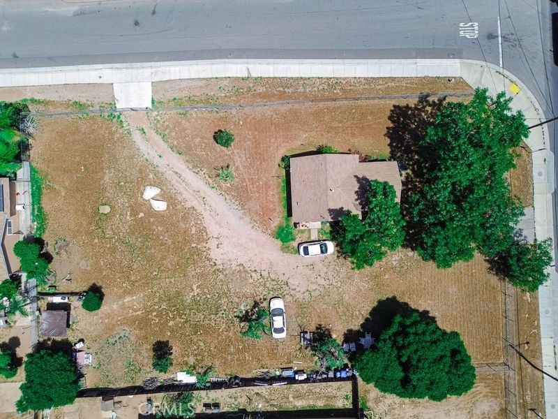 Great corner lot with a 1 bedroom, 1 bath home. The sale of this property includes 3 additional parcels APN: 174-301-038, APN: 174-301-021 and APN: 174-301-019. All 4 parcels add up to approximately 24,000 square footage. All this is a great location with easy access to Freeway and lots of commercial development is present. This is prime location for a commercial building.