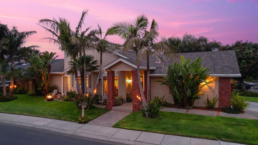 The tropical resort vibe in this significantly updated Ocean Colony home with the primary suite on the main first level offers a move-in ready opportunity. Hardwood & tile floors on the first level & an outdoor shower & spa provide for an easy clean up after visiting the beach. Boasting high ceilings in this open floor plan, the design offers a separate family room & formal dining room providing intimate settings, as does the warm gas fireplace in the living & family rooms. Sliding doors at the living room & primary suite open to the secluded yard, perfect for outdoor entertaining & relaxation. The spectacular kitchen is light & bright with stone couter tops, white cabinets & stainless steel premium appliances. The primary bath is 5 STAR worthy. Upstairs offers 2 additional bedrooms with a Jack & Jill bathroom. The elegantly maintained grounds set the tone for the casual coastal design. The garage is finished with a painted floor, textured /painted walls & sleek built-ins. The pull down ladder to the attic offers additonal storage. The private Colony Club offers membership to homeowners which includes a lap swimming pool, sauna & spas, tennis, pickleball & yoga studio. Homeowners receive significant discounts on green fees to 2 exceptional golf courses & preferred tee times.