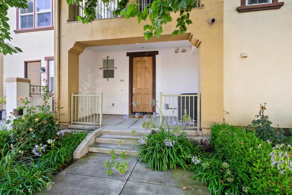 TRANQUIL TOWNHOME | This beautifully maintained, move-in ready townhome offers a peaceful retreat on a tree-lined street while still being just minutes from top local amenities. Featuring 3 bedrooms & 3 full bathrooms; all bedrooms are generously sized, each with its own walk in closet. Most profound is the spacious primary suite with dual-sink vanity, separate toilet room, even more storage & enough room to spare for a sitting or lounge area. Ideal for a guest room or a dedicated home office is the secondary ensuite upstairs or the bedroom adjacent to a full bath on the main level. The open floor plan has soaring ceilings, boasts quality flooring, plush Berber carpet, recessed lighting & a bright living area that flows to a private, secluded patio tucked away & immersed in lush greenery; perfect for that morning cup of coffee. The modern kitchen is equipped with Bosch stainless steel appliances, ample cabinetry & breakfast bar. Other highlights include a dedicated laundry room & 2-car garage. Walking distance to Light Rail & Target with easy access to BART, VTA & highways 101/680. Near Sprouts, Costco, H-Mart, Ranch 99, & Great Mall, plus major tech employers Google, Apple, Nvidia, Supermicro & Tesla. Parks & community centers just minutes away. Some photos are virtually staged.
