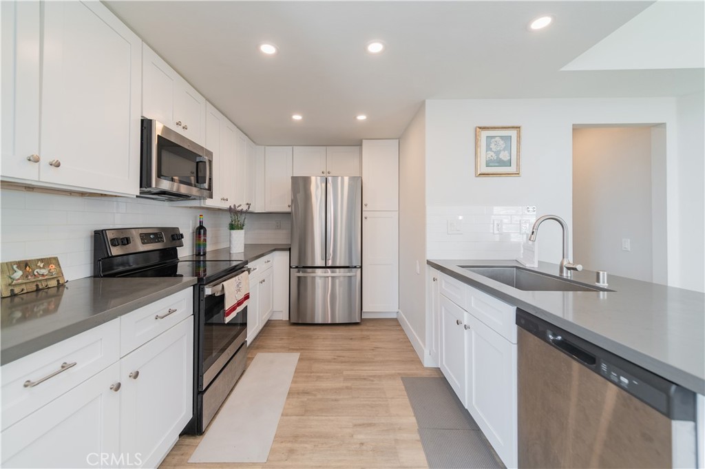 This beautiful condo is situated in the heart of Northwood. No Mello-Roos, and a Low Tax Rate! Welcome to this impeccably remodeled 2-bedroom, 2-bathroom corner end unit, offering a unique sense of privacy with no neighbors above or below. The unit includes a one-car garage directly below, ample guest parking just steps away, and an additional storage closet located under the stairs.This cozy, move-in ready home features thoughtful updates, access to a community pool, convenient parking, and proximity to excellent schools. Its charming curb appeal, paired with functional interior upgrades, makes it a standout in Northwood—ideal for starting fresh or settling into a peaceful home.Nestled in the highly desirable Northwood Horizon community, this property is just minutes from the Irvine Spectrum, The Marketplace, Great Park, major freeways, and top-rated schools. It’s also conveniently close to local businesses, daily shopping, and within easy reach of IVC and UCI.