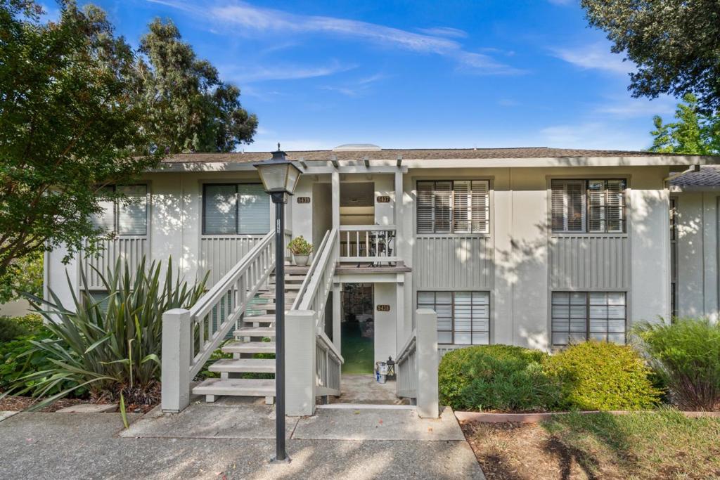 Welcome to this inviting condo in The Villages Golf & Country Club, a premier 55+ community. This home offers a private back patio w/ peaceful views, perfect for relaxing in comfort & privacy. Inside, the updated kitchen features painted cabinets, a spacious pantry, stainless steel appliances, & granite countertops. The highly sought-after open-concept floor plan seamlessly connects the kitchen to the dining area, w/ the sink positioned to overlook the patio and greenery beyond. Both bathrooms have been refreshed w/ modern fixtures & lighting, while tile flooring in the bathrooms & laminate throughout the living areas combine style w/ low-maintenance living. An interior laundry in the storage room & a covered parking spot just steps away add everyday convenience. Life at The Villages offers resort-style amenities including a championship 18-hole golf course, a 9-hole course, & a driving range. Residents enjoy tennis, pickleball, bocce, six pools, four spas, a fitness center, horseback riding, & scenic hiking trails. The community also features a library, post office, community center, & dining options ranging from the casual bistro to fine dining in the clubhouse.