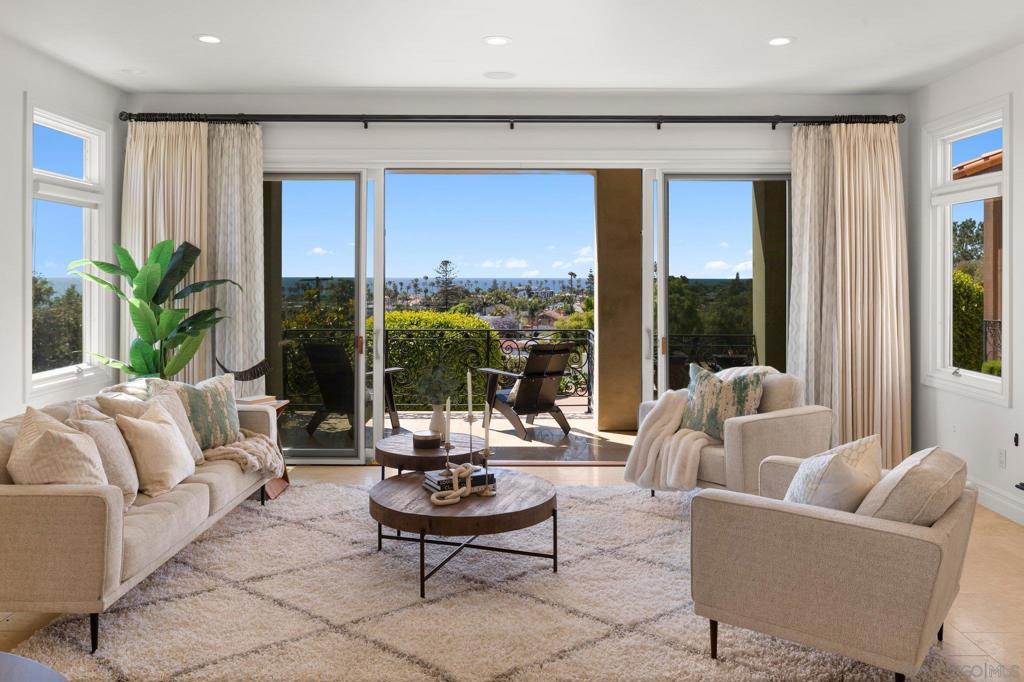 With sweeping ocean and sunset views, this impeccable Mediterranean contemporary is set on a half-acre lot on a quiet cul-de-sac between La Jolla Village and Bird Rock, walking distance to Windansea Beach and with direct access to the La Jolla Bike Path. Extensive windows bathe interiors in light while elegant design and craftsmanship foster luxury and comfort. Most of the five ensuite bedrooms, and several public spaces, boast private view terraces, while the pool, spa, patio and gardens offer splendid areas for social gatherings or relaxation. Complementary, easy-to-care-for landscaping and fruit trees add to the beauty and natural setting. With its serene ambiance and harmonious blend of livability, beauty and convenience, this striking home is a must-see.
