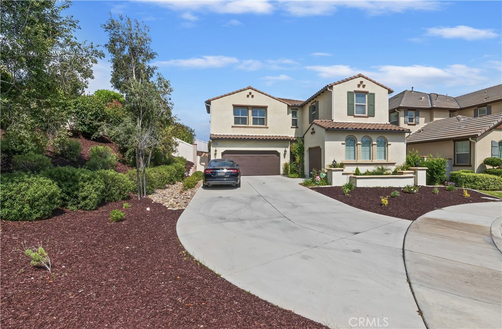 LOCATION! LOCATION! MOVE-IN-READY! PAID OFF SOLAR! Shows like a model - upgrades galore! Upgraded floors. Upgraded countertops. Upgraded Master Bath. Upgraded Shutters. Upgrades + This home is over 3500 sq ft with an open floor plan, and it's located on a cul-de-sac with what looks to be the 2nd largest lot in the entire community. This is the best of the best. There's a full bathroom and a very large bedroom on the main floor, plus an office enclosed by glass bay doors. Formal hallway leads you to a true luxury experience where you will find, to the left: a stunning large kitchen with a large island and walk-in pantry next to a gorgeous dining area with views of the backyard. To the right: A huge living/family room with a gorgeous fireplace. The living room is pre-wired for a surround system. A full wall of glass sliders that open to a covered "California-Room" large enough to accommodate an expansive lounge set up giving you a true "indoor/outdoor" living experience, also has its own fireplace to add that extra cozy ambiance for those relaxing outdoor evenings. The backyard has "plumbing" for a pool that was done ahead of time when the hardscape was completed. The backyard is MASSIVE and STUNNING!! Already completed enough to enjoy as-is, while also not overly done, you can still add your own touches to showcase your personality and lifestyle. Upstairs is a HUGE loft. The model home used the cutout as a sink/drink station and had a small movie theatre / viewing area. This space is massive! Current owners used it as a pool table area. The master is separate from the other bedrooms upstairs and is oversized, as is most everything here. There's a king bed frame shown now and it looks small in this room - Master will easily accommodate most bedroom sets, plus some chairs for a reading space or?? The Master bath is ALSO HUGE with separate "his-hers" sink areas, and a bath tub located across an oversized walk-in "spa-like" shower. The remaining bedrooms are located upstairs and are oversized. The clubhouse you will see as you enter through the guard gate. The community offers country club-like amenities including clubhouse, gym, pool, spa, tennis courts, basketball courts, tot lots, central park, and a private walking trail that is approx 3 miles long with a "forest-like" feel. Just minutes from shopping, wineries, award-winning Temecula school district, mall, restaurants, old town Temecula - must see to appreciate! This one is actually better in person!