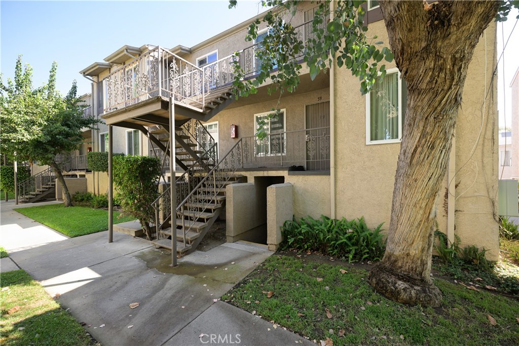 Welcome to this charming 2 bedroom 2 bathroom home in a gated community! Walk in to an updated kitchen, wood flooring throughout the house, along with a tankless water heater and scraped ceilings. The community has a pool, hot tub and play ground. Close to freeways, Cal State LA and shopping.
