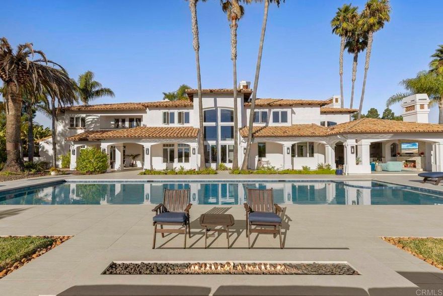 Stunning custom estate located in the exclusive, guard gated community of Wildflower Estates, Olivenhain’s most sought after neighborhood. Set on two private acres, this home has undergone a complete top-to-bottom renovation—no expense spared. The owners invested heavily to transform every inch of the property with designer finishes, luxury materials, and state-of-the-art systems. **100% move-in ready**  The brand-new chef’s kitchen features custom cabinetry, high-end professional-grade appliances, granite countertops, and an oversized island perfect for entertaining. Lavish Primary Suite with spa-inspired primary bath featuring dual closets and large walk-in shower. Throughout the home, you’ll find all-new custom flooring, designer lighting, and upgraded fixtures that elevate the style and comfort of every room.  The flexible floor plan offers two downstairs bedrooms, including a guest suite with French doors opening directly to the pool, as well as an executive office and a wine cellar.  Step outside to your own resort—complete with a newly refinished saltwater pool and spa, surrounded by lush tropical landscaping and panoramic views of the Olivenhain Valley to the ocean. The expansive outdoor living area includes a brand-new outdoor kitchen and BBQ, a covered loggia with fireplace, and multiple seating areas for seamless indoor-outdoor entertaining.  With no Mello-Roos, a six-zone HVAC system, and meticulous attention to detail throughout, this exceptional estate offers the rare opportunity to own a fully remodeled, turnkey luxury home in one of San Diego County’s most prestigious gated communities.  Wildflower Estates is the premier guard gated, equestrian community in Olivenhain. It sits above Spooks Canyon with access to its' year round river and hiking trails and is minutes to Encintias beaches, shopping & restaurants. Wildflower Estates has all the privacy and exclusivity of Rancho Santa Fe at a fraction of the cost and a much better location.