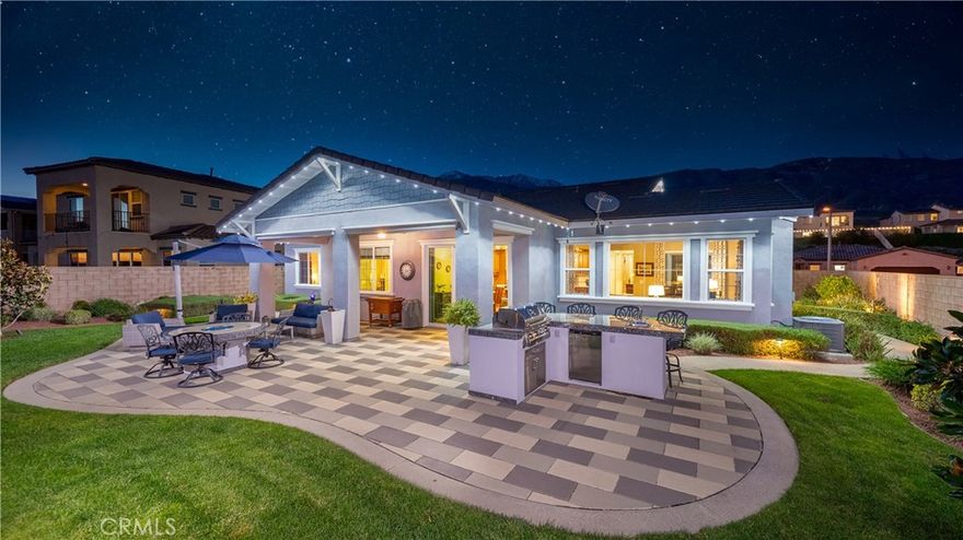 Rancho Etiwanda Estates Single Story with Spectacular City Light & Mountain Views. This beautiful single-story home sits in Rancho Etiwanda Estates and delivers rare panoramic city light and mountain views. The curb appeal is impressive, featuring custom professional landscaping, hardscape lighting in front and back, LED lighting wrapped around the exterior, and fresh paint inside and out. A large, inviting front porch captures a perfect mountain view, & the Ring doorbell adds convenience and security. Inside, the home offers 3 bedrooms plus a dedicated office. Crown molding runs throughout. High-quality Pergo flooring adds warmth, & every bedroom features a ceiling fan with lighting.  Each bedroom features an en-suite bathroom with a custom walk-in shower, detailed tile work, linear drains, & frameless glass doors. All closets feature upgraded organizers.  The primary bath features a separate walk-in shower and oversized soaking tub, dual vanities, a makeup station, and a large walk-in closet with custom shelving and shoe racks. The office is a peaceful retreat with a ceiling fan and direct access to the serene center courtyard. A large formal dining room with a centerpiece chandelier sets the stage for gatherings. The family room includes a cozy fireplace with a mantle, an oversized ceiling fan, a media niche, and another access point to the courtyard. Natural light fills this home, keeping it bright and welcoming throughout the day. The kitchen opens to the family room and includes a breakfast nook with a panorama door that expands the indoor-outdoor experience. The kitchen features include a center island with a breakfast bar, granite countertops, pendant lighting, a new sink, stainless steel appliances, a cooktop with range hood, and a generous walk-in pantry. 10-foot ceilings create a sense of space and ease.  The home also includes a full interior sprinkler system for added safety. The 3-car tandem garage with custom-built-in cabinetry, epoxy-coated floor, a workstation, tankless water heater, 2 sun-powered battery packs at 13 kilowatts each. 18 solar panels produce 430 watts each. The home is also wired for an alarm system. The backyard is designed for enjoyment, and the views are unforgettable. The panorama door leads out to a BBQ island, firepit, custom pavers, detailed landscaping, hardscape lighting, and a California room with fan and lighting. The mountain and city light views are unobstructed and some of the best you will find.