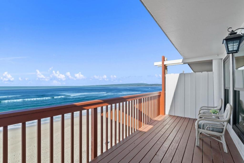 Step into your dream beachfront home, just steps from the sand and surrounded by miles of stunning coastline to explore and enjoy. Completely remodeled in 2024, this property offers the perfect blend of modern updates and coastal charm, ready for you to move in and start living the good life. As you enter, you're greeted by soaring ceilings and an abundance of natural light, enhanced by a skylight. The main level features two spacious bedrooms, each with bay windows framing breathtaking ocean views, and a beautifully updated full bathroom with elegant porcelain floors and walls. On the mid-level, you'll find an inviting living room with a cozy gas fireplace, a stylish dining area, and a kitchen that will delight any chef. The kitchen boasts sleek quartz countertops, brand-new appliances, and ample space for entertaining. Step out onto the south-facing deck to soak in sweeping views of Monterey Bay, where you can watch whales, dolphins, and other sea life in their natural habitat. The lower level offers an additional bedroom with its own outdoor access, leading to a walkway and direct stairway to the beach. Whether you're enjoying the home as a serene personal retreat or leveraging it as a vacation rental, this property is a rare gem offering both relaxation and potential income.