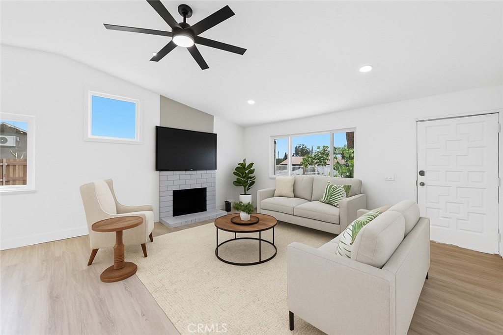 Nestled in the heart of Moreno Valley’s coveted Edgemont neighborhood, this fully remodeled 3-bedroom, 2-bath gem is a true standout. Offering modern updates and a flexible bonus room that can easily serve as a 4th bedroom or guest suite, this home is move-in ready and won’t last long! The charming gated front yard welcomes you with mature succulents, a flourishing grapevine, a majestic palm tree, and a fruitful peach tree. With a 2-car garage, a fenced area perfect for a dog run or garden, and ample curb appeal, the exterior sets the stage for what’s inside. Step into an open-concept living space awash with natural light, courtesy of brand-new dual-pane windows. Recessed lighting and sleek luxury vinyl plank flooring flow throughout, creating a warm and inviting atmosphere. The chef’s kitchen is a showstopper, boasting stunning Calacatta gold quartz countertops, top-of-the-line stainless steel appliances, and a large peninsula bar, perfect for entertaining or casual family meals. Relax in the primary suite, where you’ll wake up to breathtaking views of the lush golf course. The spa-inspired en-suite bath features dual vanities and a beautifully tiled walk-in shower, offering the ultimate retreat. A versatile flex space within the suite is perfect for a nursery, office, or serene reading nook. Two additional bedrooms plus the bonus room provide ample space for family, guests, or whatever your lifestyle demands. The main bath dazzles with a soaking tub, updated vanities, and a unique distressed-style picket fence tile surround, adding character and charm to the space. Outside, the private backyard is an entertainer’s dream. Enjoy serene golf course vistas, a tranquil cactus garden, a cozy firepit circle, and a spacious paved area ideal for BBQs and outdoor gatherings. With the potential for an ADU on this expansive lot, the possibilities are endless, whether you’re looking to expand your living space or create rental income. This move-in ready home is brimming with modern finishes, thoughtful upgrades, and plenty of flexible living space to suit your needs. Conveniently located near schools, shopping, and major freeways, this property checks all the boxes for comfort, style, and future growth. Homes like this don’t last long, schedule your showing NOW and make this Edgemont beauty yours today!